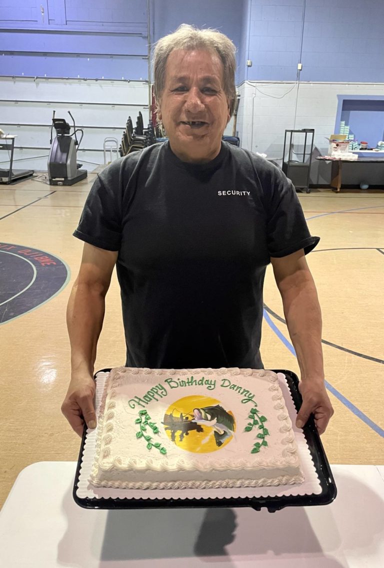 Danny Bugg Birthday Portrait Holding Cake